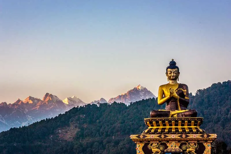 Buddha statue and Himalayan mountain landscape in Sikkim